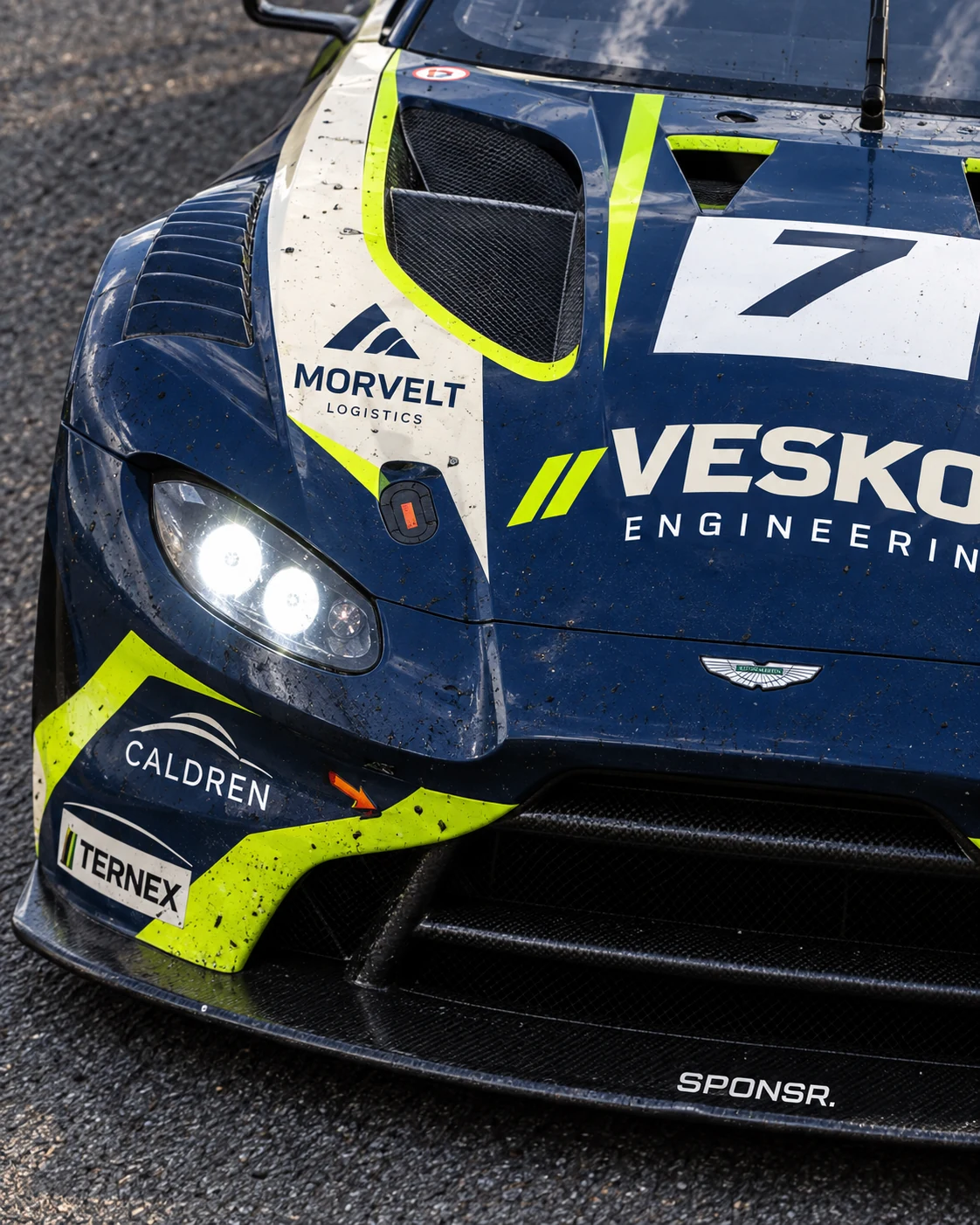 The rear wing and flank of a GT car in close-up (SPONSR livery concept).