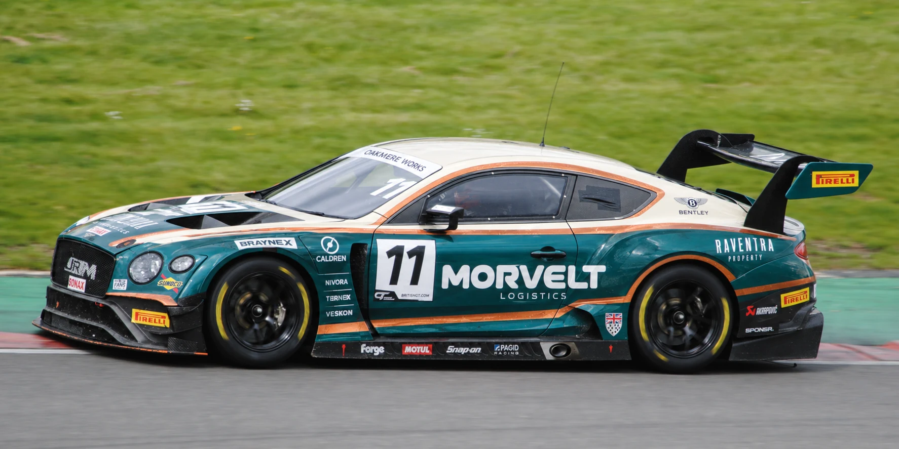 A green and cream Bentley Continental GT3 side-on at speed (SPONSR livery concept).